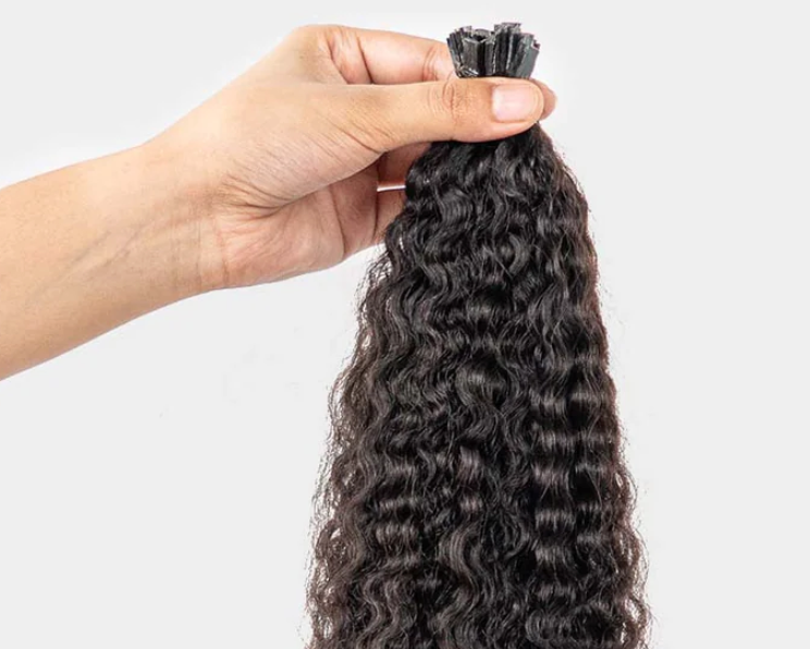 UltimateHairWorld I-Tip and Keratin hair extensions shown in a close-up image featuring seamless, natural-looking hair strands.