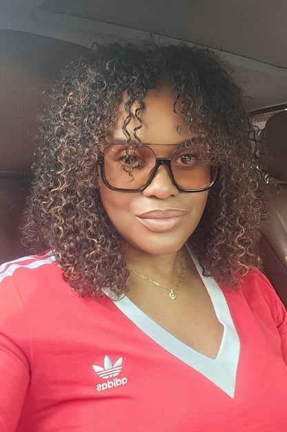 Close-up of a baby girl with soft, curly hair styled with Baby Curl from UltimateHairWorld, showcasing her adorable curly hairstyle.