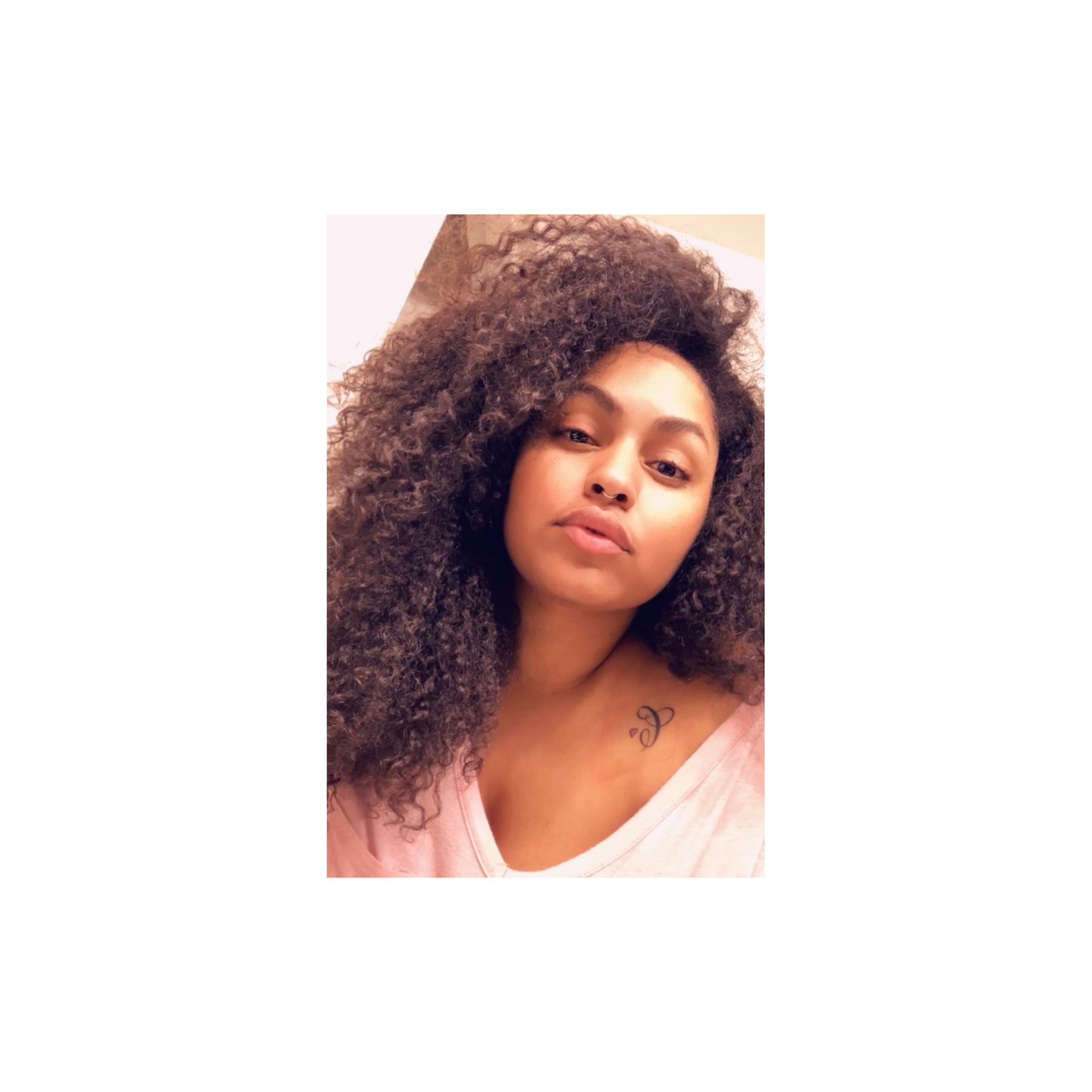 Baby Curl hairstyle featuring soft, natural curls styled by UltimateHairWorld on a model with shiny, healthy hair.