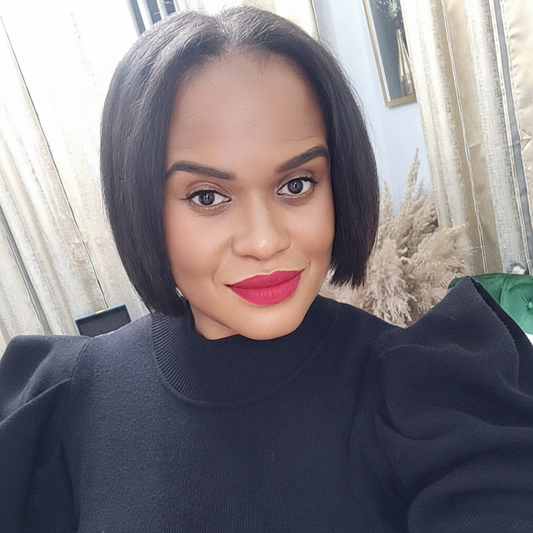 Black seamless clip-in hair extensions from UltimateHairWorld worn by model with a sleek bob hairstyle.